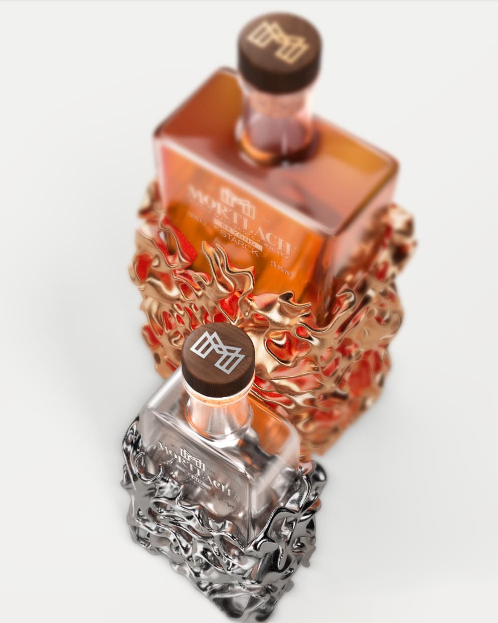 A top-down shot of the Two Mortlach whisky bottles, BEGIN & BEYOND, one in a golden honeycomb-inspired casing and the other in a silver counterpart,  against a clean, off white backdrop.