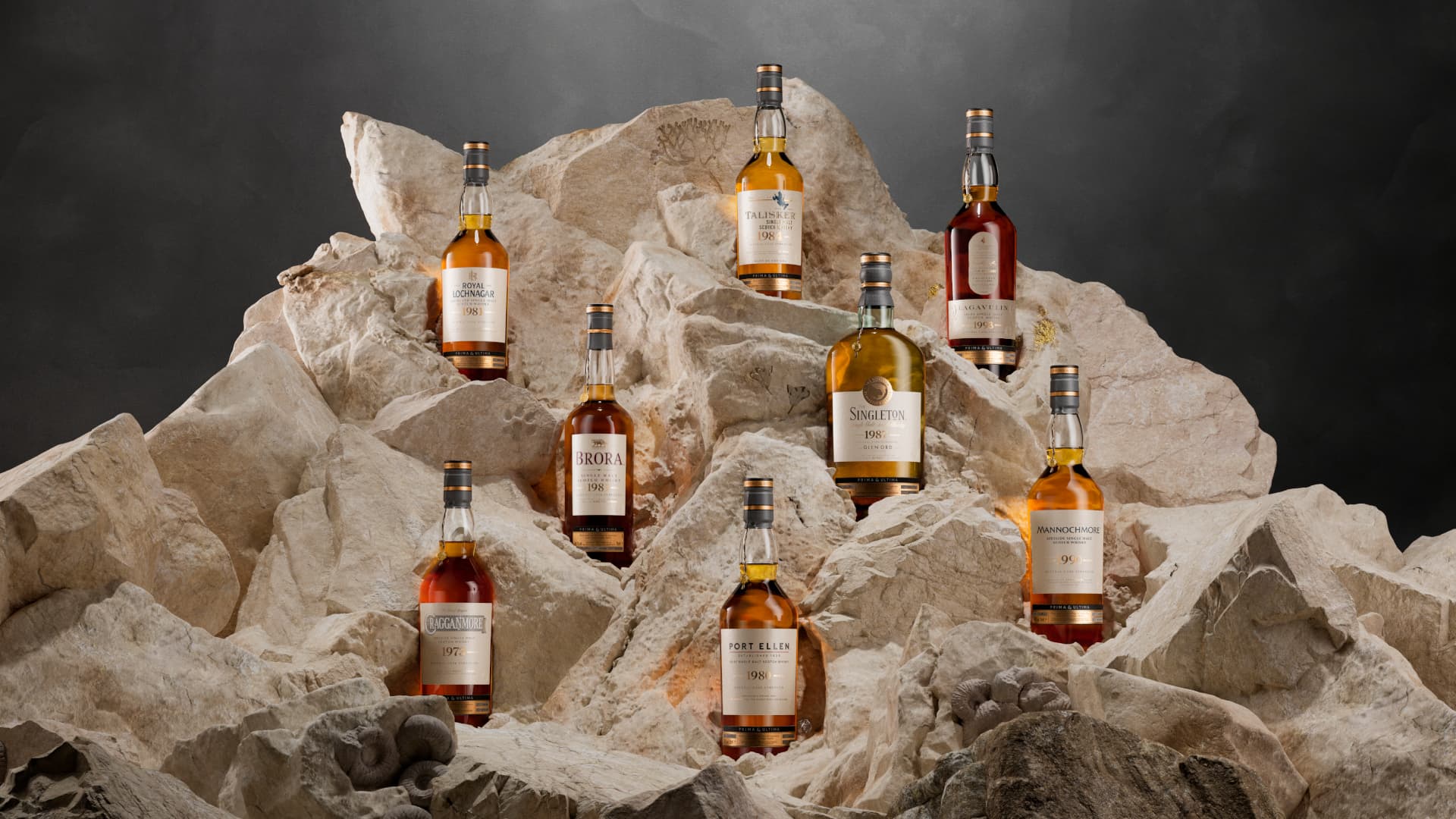 Prima and Ultima Third Release Whiskies set against a natural stone backdrop