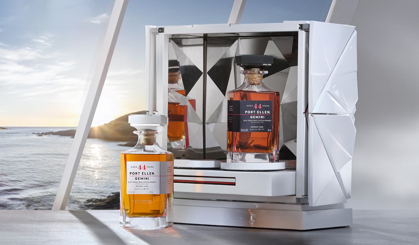 Twin port ellen gemini whisky bottles in front of a white case and window with ocean view