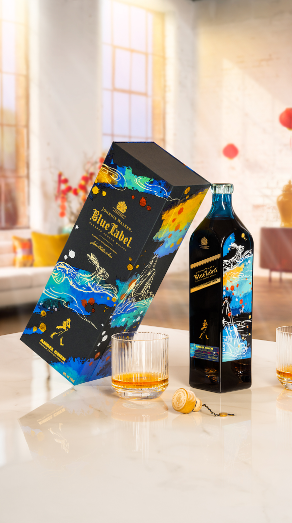 Johnnie Walker Blue Label Lunar New Year Limited Edition Design pictured next to a neat serve in a whisky rocks glass