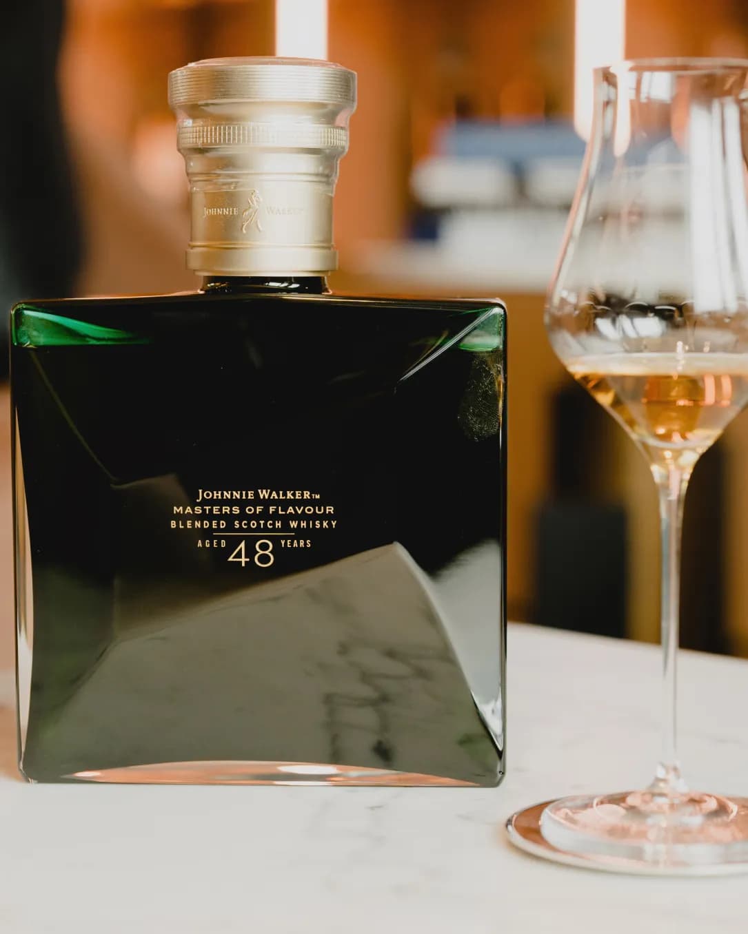 Johnnie Walker Masters of Flavour bottle with a serve